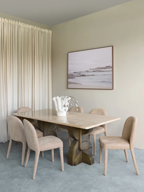 Ashford dining table with a natural travertine top and metal legs. A modern luxury dining table measuring 200 × 100 cm.