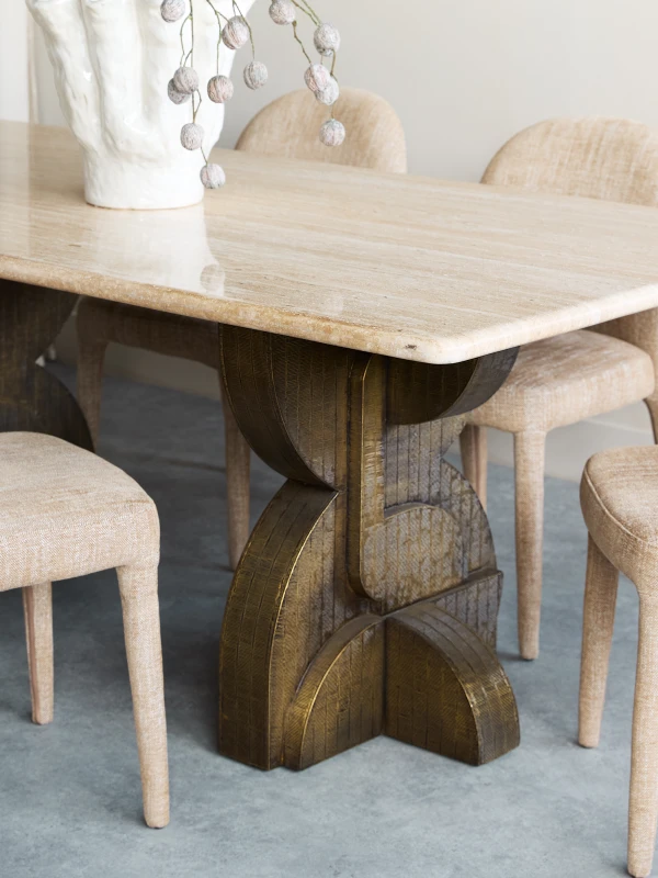 Ashford dining table with a natural travertine top and metal legs. A modern luxury dining table measuring 200 × 100 cm.
