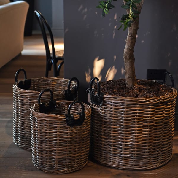 Hand woven rattan baskets with leather handles for living room storage