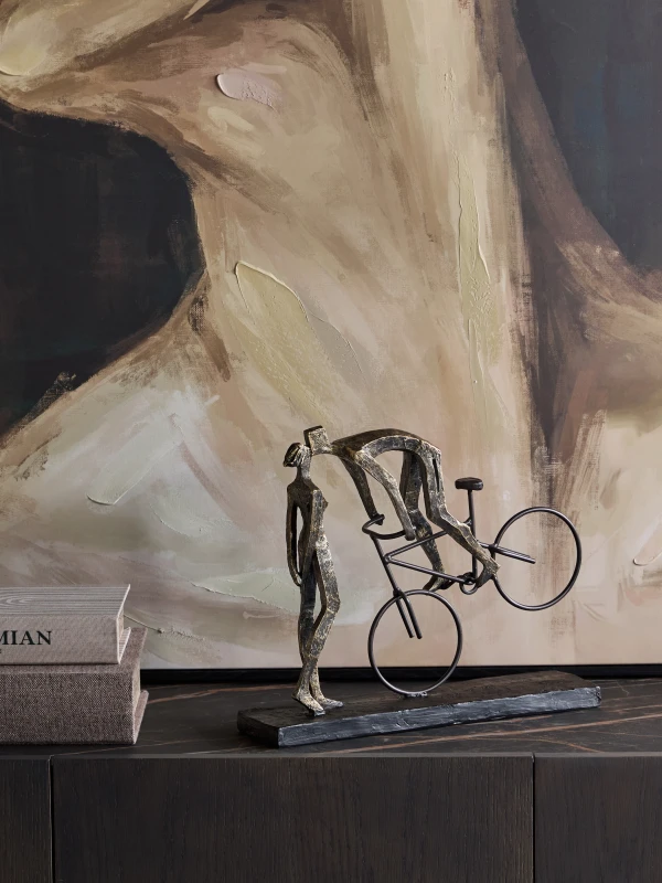 Decorative couple on bicycle sculpture in antique bronze