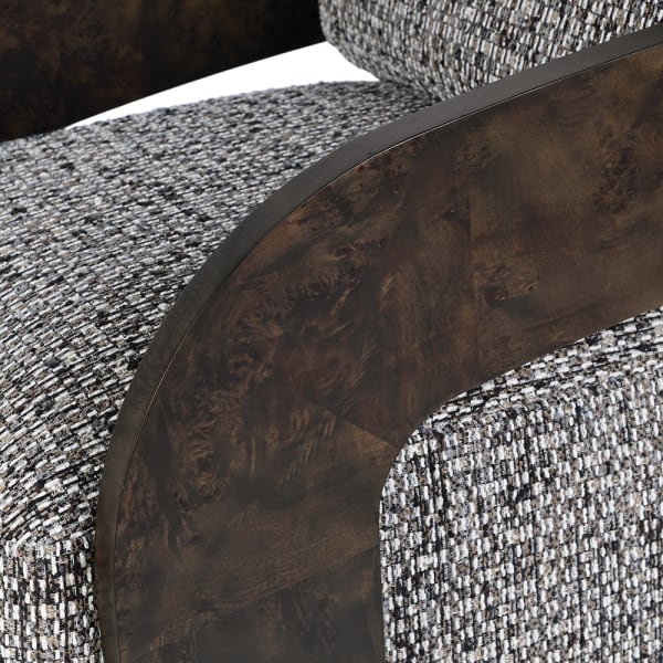 Grey upholstered swivel chair with curved ash veneer armrests