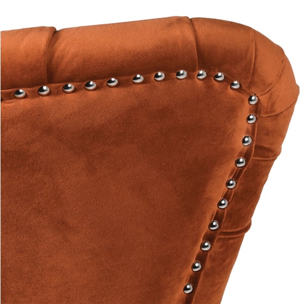 Close-up of metal stud detailing on the Boscobel Orange armchair