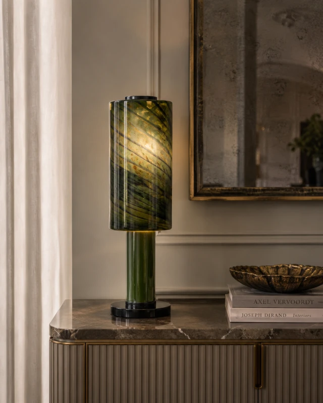 Green glass table lamp with dark flowing decorative lines