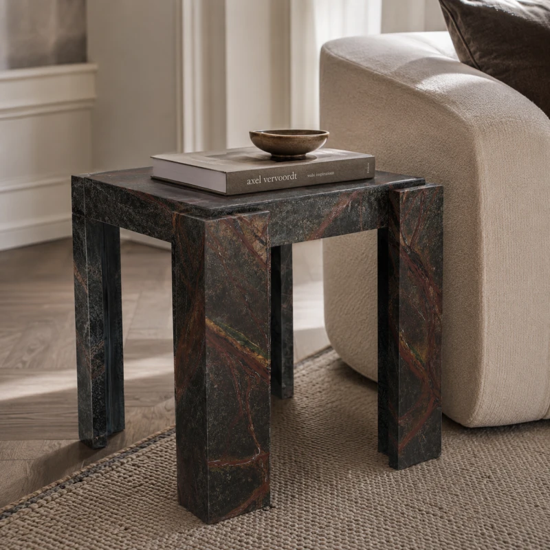 Dark marble side table with rust-red natural veining