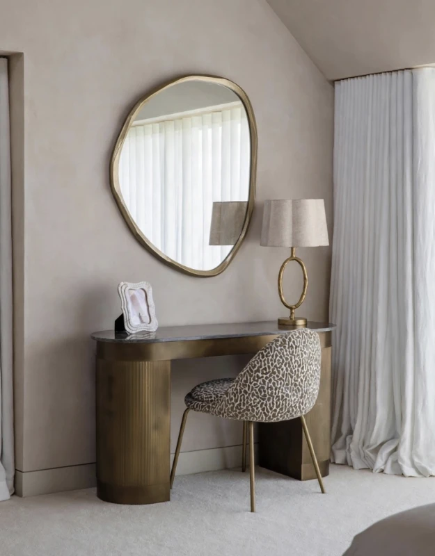Animal Print chair with patterned upholstery and elegant gold legs. A bold accent piece for modern interiors.