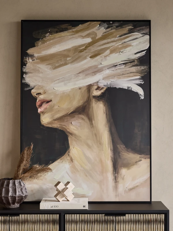 Large female portrait artwork in a black frame