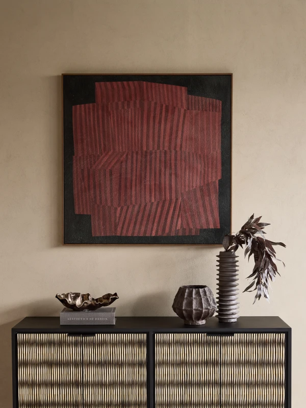 Red Vibes displayed above a contemporary sideboard