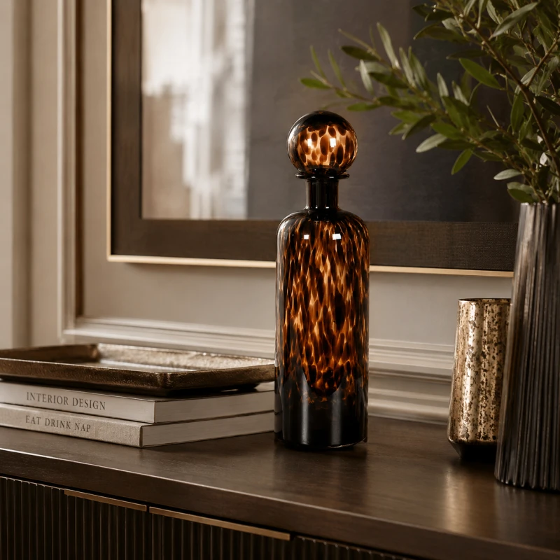 Brown glass bottle with spherical stopper