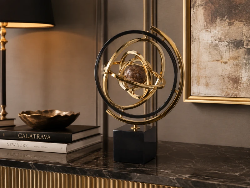 Gold armillary sphere with brown marble centre