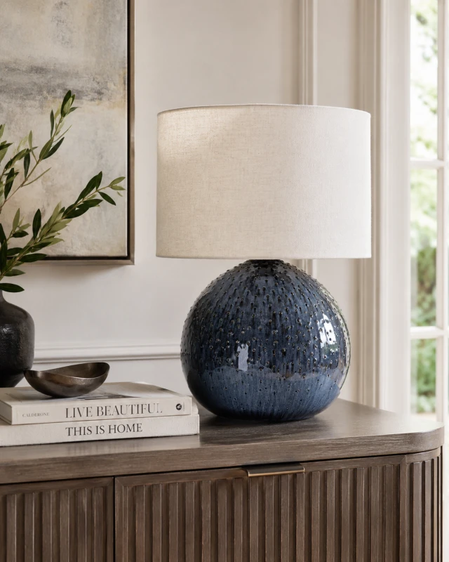 Dark blue table lamp with cream linen shade