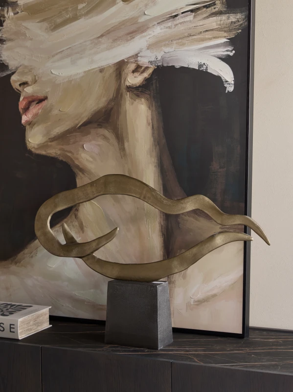Large aluminium Waves sculpture on a black base