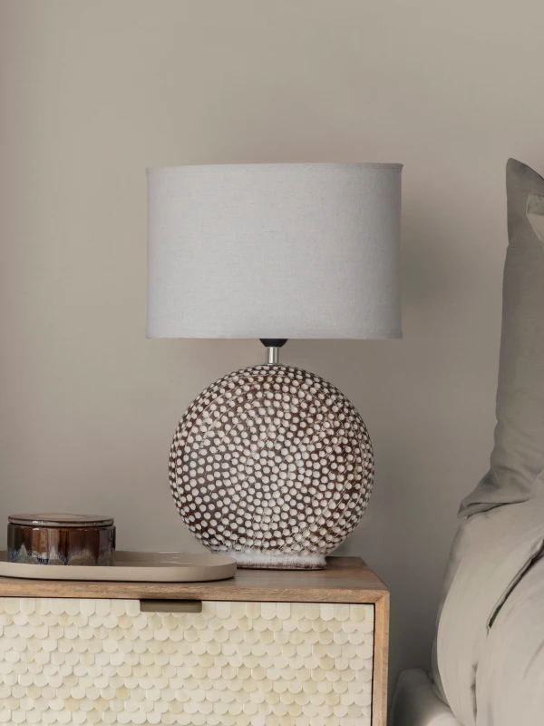 Brown ceramic lamp with pale natural linen shade