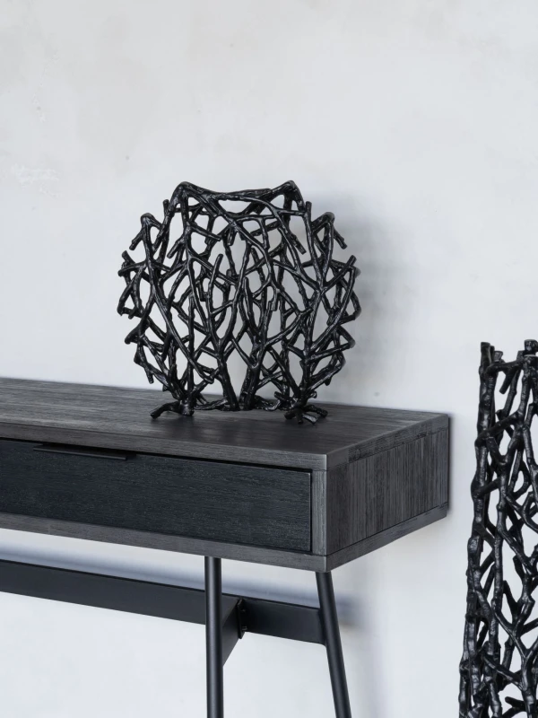Round black decorative vase with sculptural form