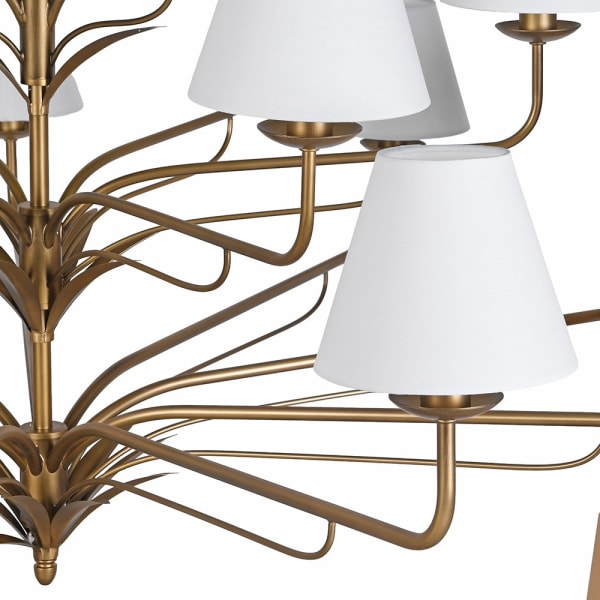 Large gold chandelier with white linen shades