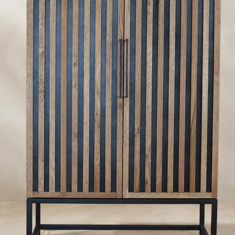 Close-up of Enderby Wood cabinet showing vertical oak slats and black handles