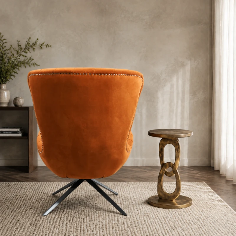 Burnt-orange velvet accent chair with deep button tufting