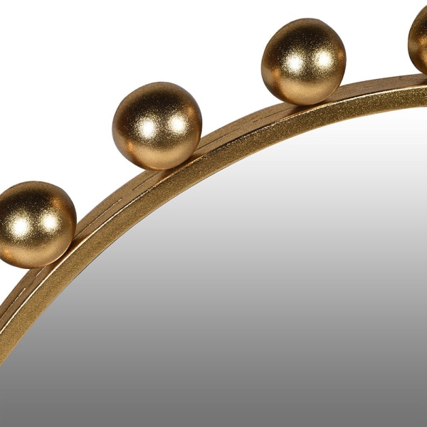 Close-up of the Bubble Gold mirror’s textured gold-toned iron frame and spherical details