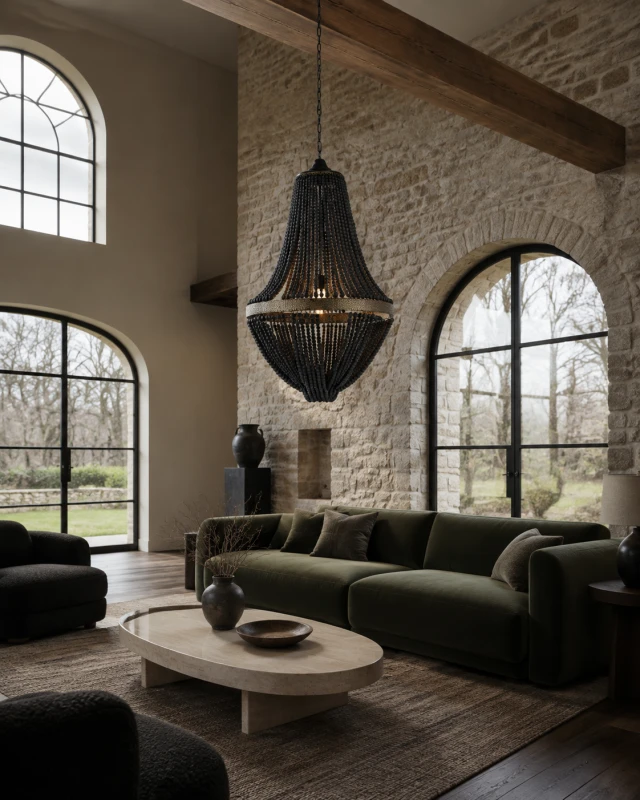 Black wooden bead chandelier, 71cm wide, in a luxury rustic living room with a stone feature wall