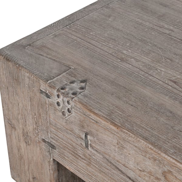 Close-up of reclaimed pine grain and aged metal fittings on the Tuscany coffee table