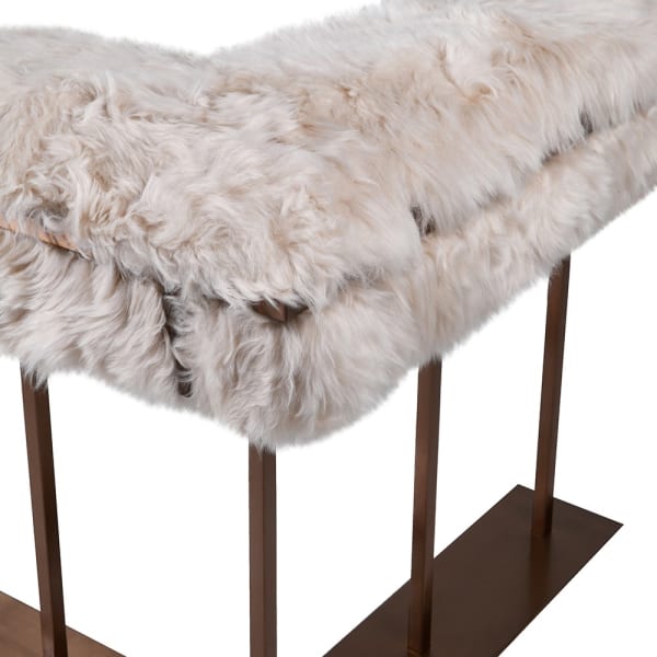 Natural New Zealand shearling upholstery on an almond fire fender