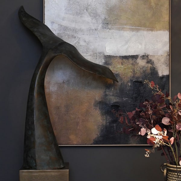 Large Whales whale tail sculpture displayed in a luxury interior