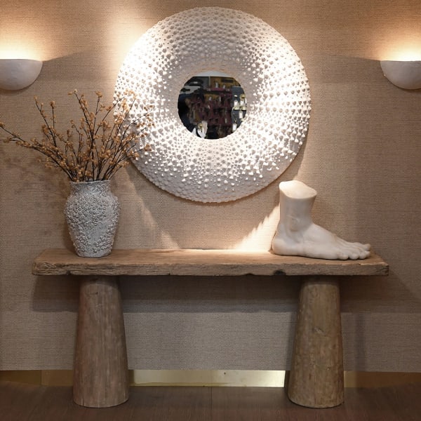 Piede Light foot sculpture displayed on a wooden console table