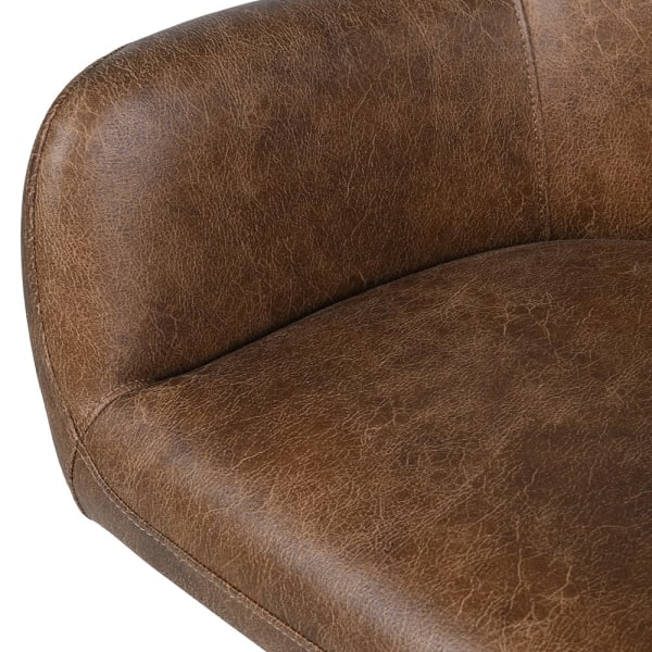 Close-up of faux leather upholstery on Chester dining chair