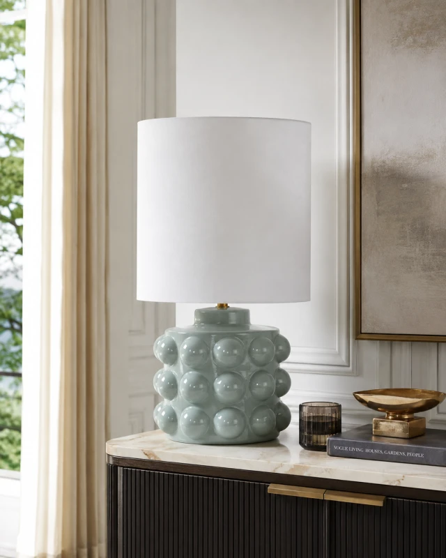 Kew green ceramic table lamp with glazed bobble texture and natural linen shade