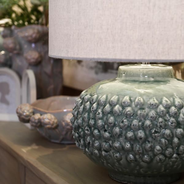Glacier ceramic table lamp with linen shade styled on a sideboard