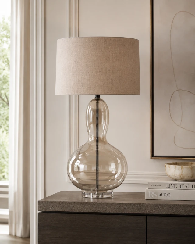 Langham amber glass table lamp styled on a console in a refined interior