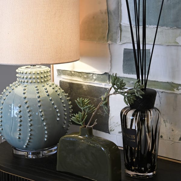 Regent Blue table lamp styled on a console in a refined interior