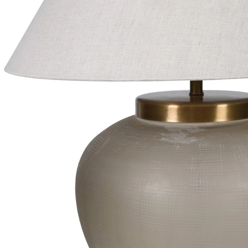 Close-up of smoked taupe glass and brass detailing on Fritzovia S table lamp
