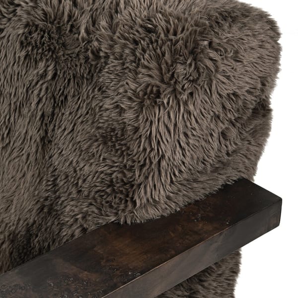Close-up of dark burl veneer armrest on Portobello swivel armchair