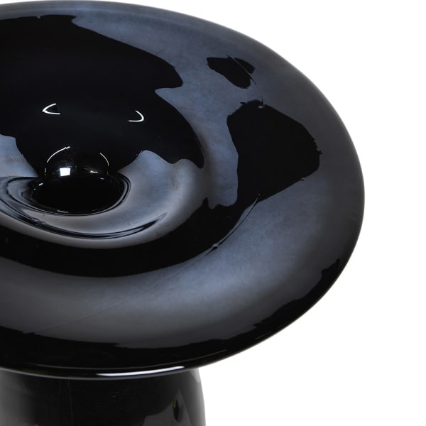 Close-up of glossy black glass and curved top of Hat Black vase