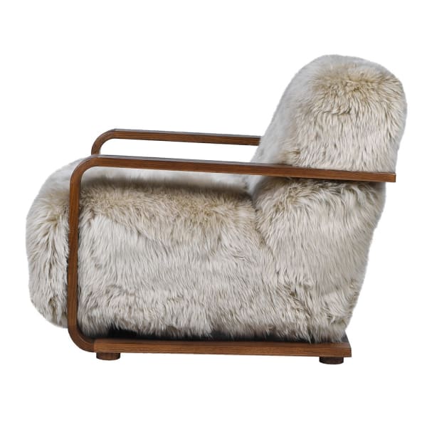 Highgate sheepskin lounge chair with curved oak arms side view
