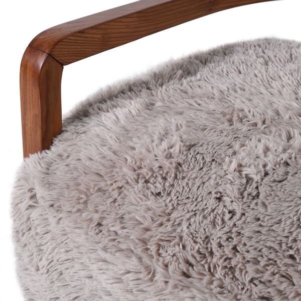 Close-up of faux fur upholstery and ash wood arm on Hampstead chair