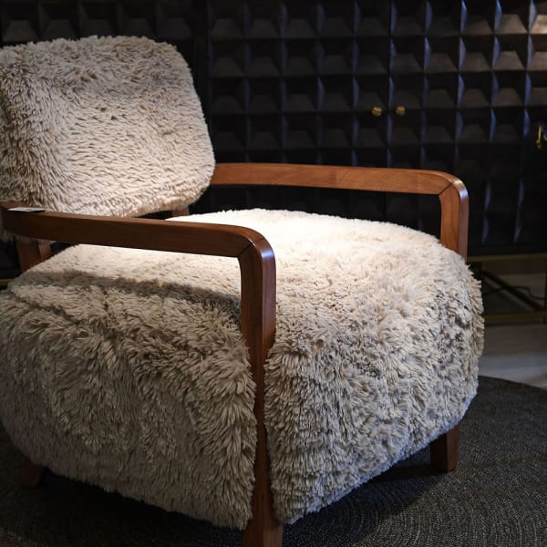 Hampstead faux fur armchair in an elegant contemporary interior