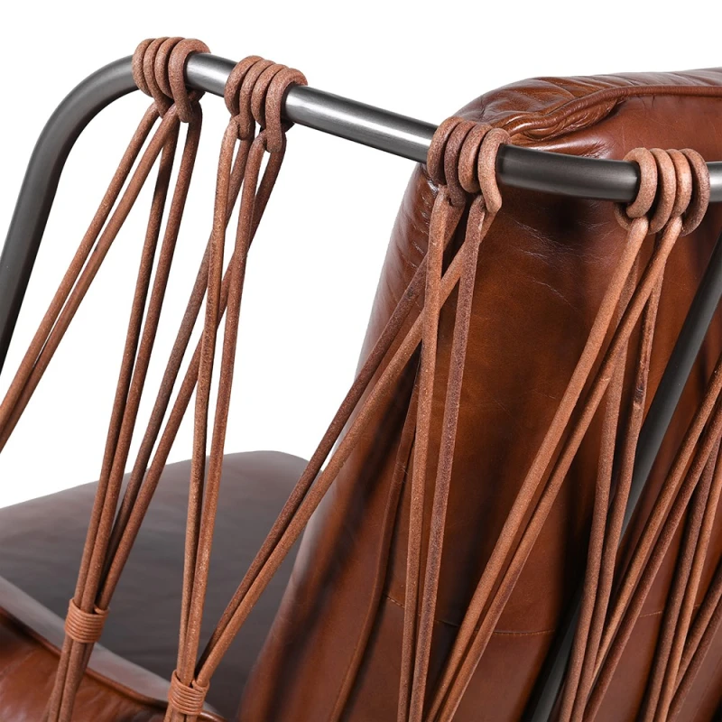 Decorative laced back and iron frame on Chelsea leather armchair