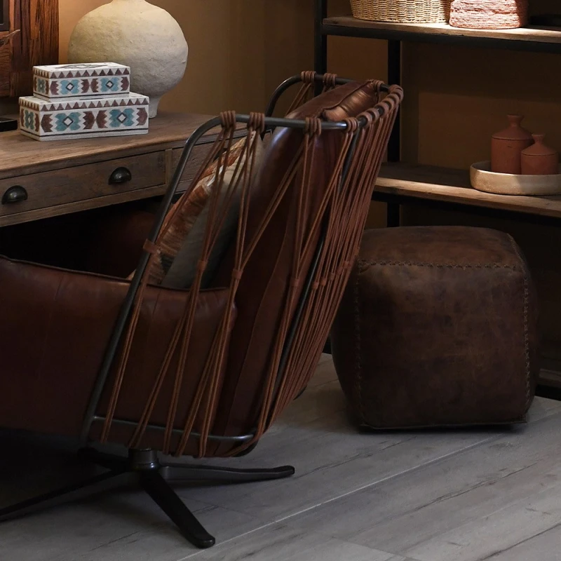 Chelsea leather chair with decorative laced back in a refined interior
