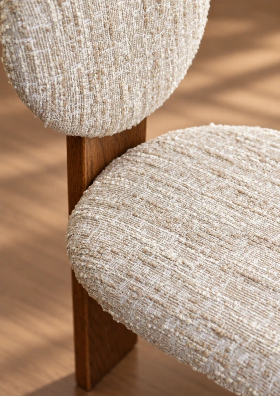 Close-up of Holland Park cream bouclé dining chair upholstery