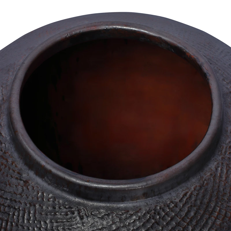 Close-up of St James black vase glazed finish with brown undertones