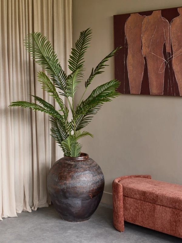 St James Black Floor Vase styled with tall foliage in an elegant interior