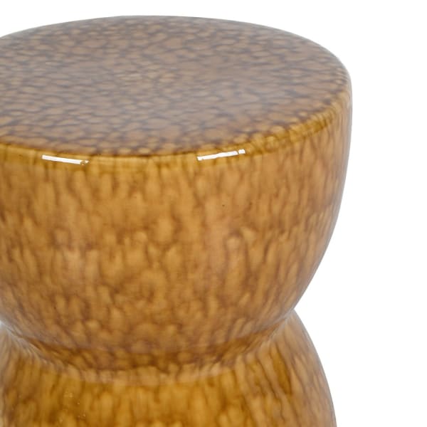 Close-up of glazed ochre ceramic finish on Kew stool