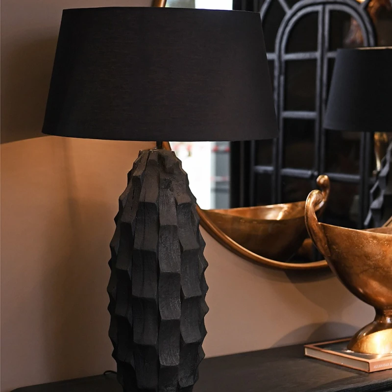 Obsidian Mango black table lamp styled on a console in a refined interior