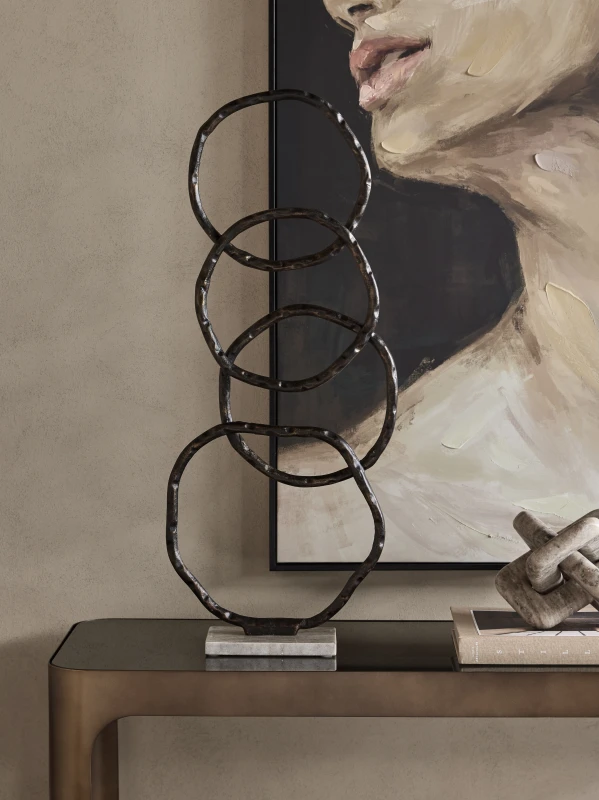 Evren abstract sculpture styled on a console table in a refined interior