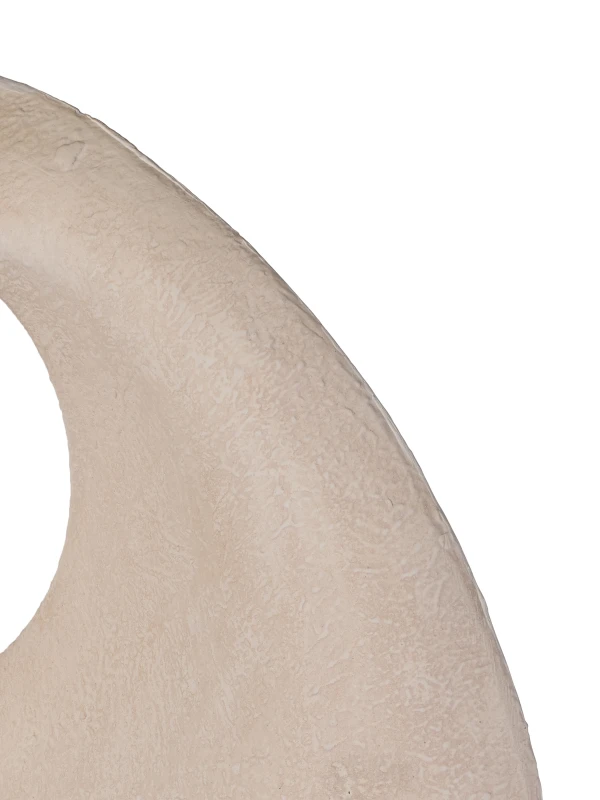 Close-up of matte textured cream finish on Solenne sculpture
