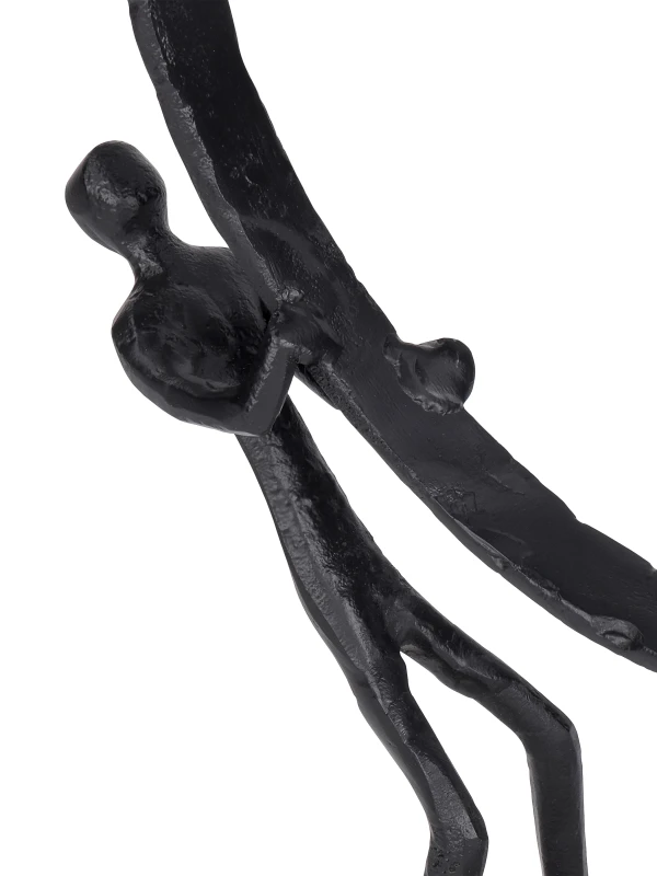Close-up of two abstract figures on Balance sculpture