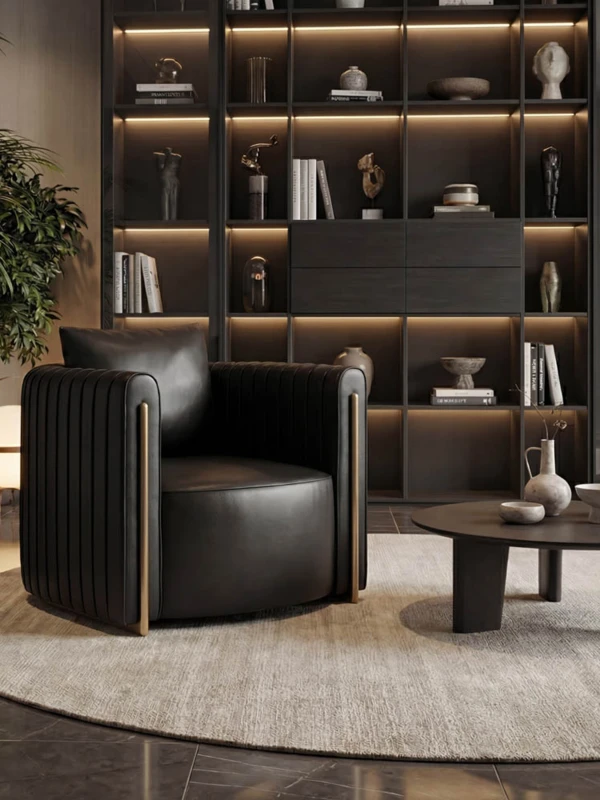 Black lounge chair with gold stainless-steel detailing