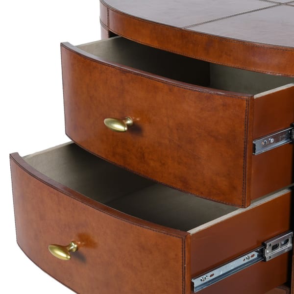 Close-up of brown leather drawer and gold handle