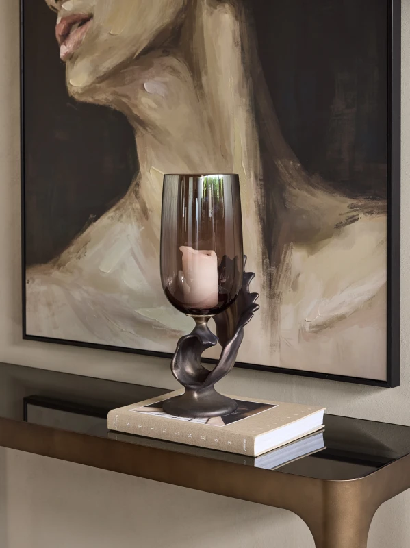 Decorative smoked glass candle holder with sculptural bronze base